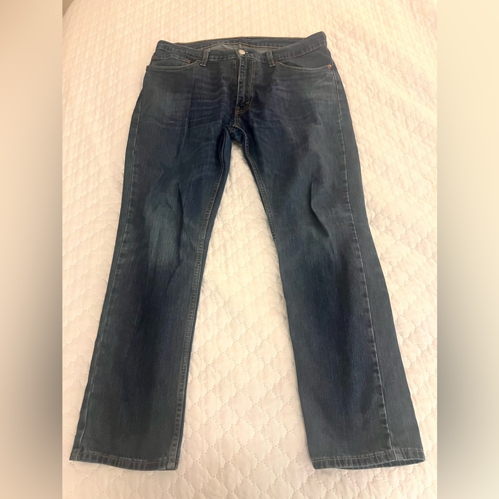 Pair of lightly worn Levi’s 511 36x29 blue distressed jeans